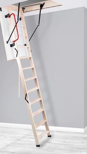 A timber folding loft ladder down from a hatch in a landing ceiling.